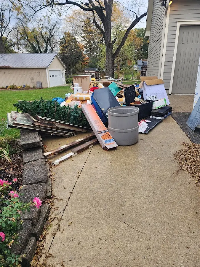 Dumpster being loaded with debris for 30 Yard Dumpster Rental in Lockwood